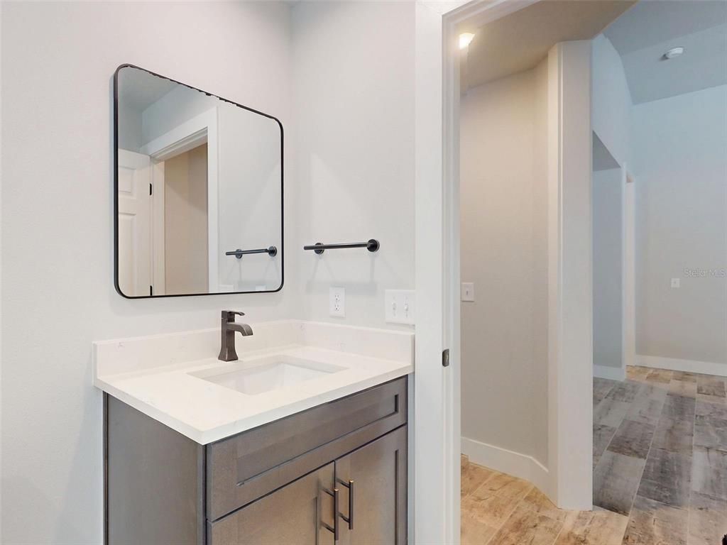 Bathroom, Dual Sink Vanities, Interior, Recessed Lighting, Wood Texture Flooring