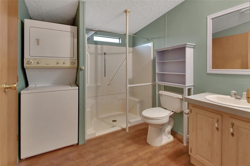 Bathroom, Glass Shower, Interior, Utility Closets, Washer, Wood Texture Flooring