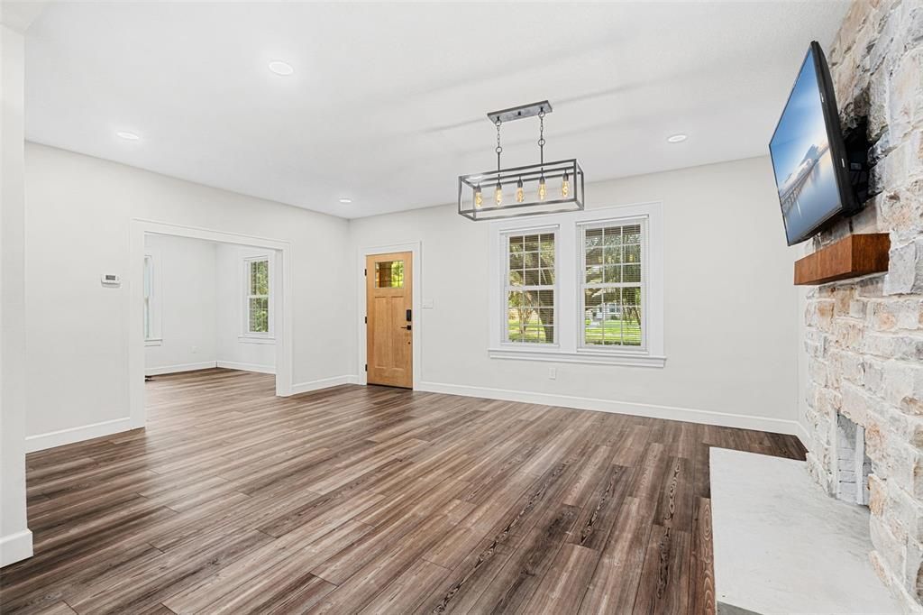 Empty room, Fireplace, Interior, Pendant Lights, Recessed Lighting, Wood Texture Flooring