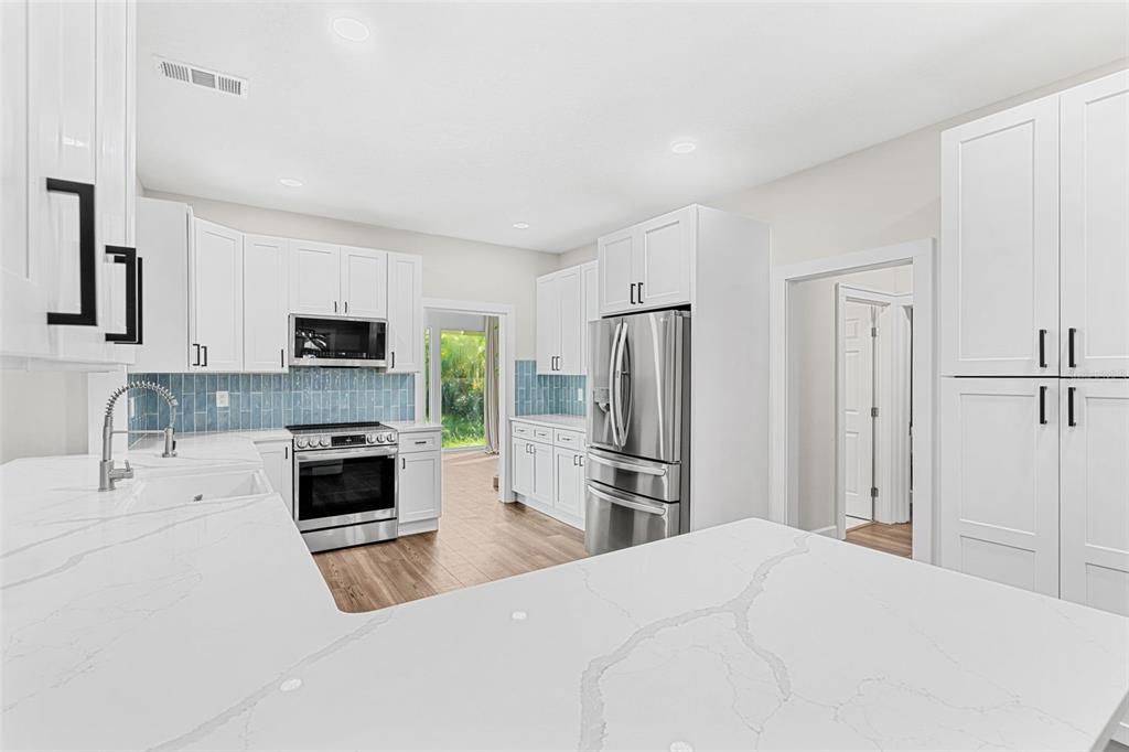 Interior, Kitchen, Recessed Lighting, Stainless Steel Appliances, Wood Texture Flooring
