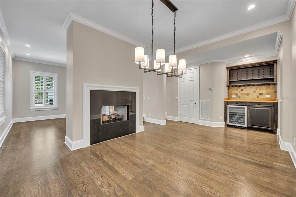 Empty room, Fireplace, Interior, Kitchen, Pendant Lights, Recessed Lighting, Wood Texture Flooring