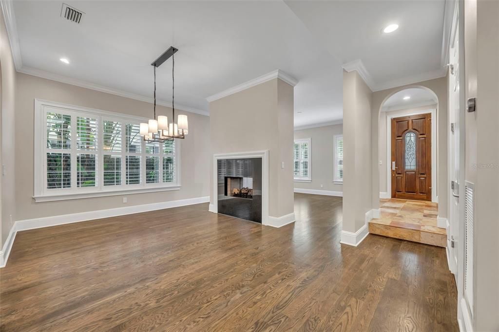 Chandelier, Empty room, Fireplace, Interior, Pendant Lights, Recessed Lighting, Wood Texture Flooring