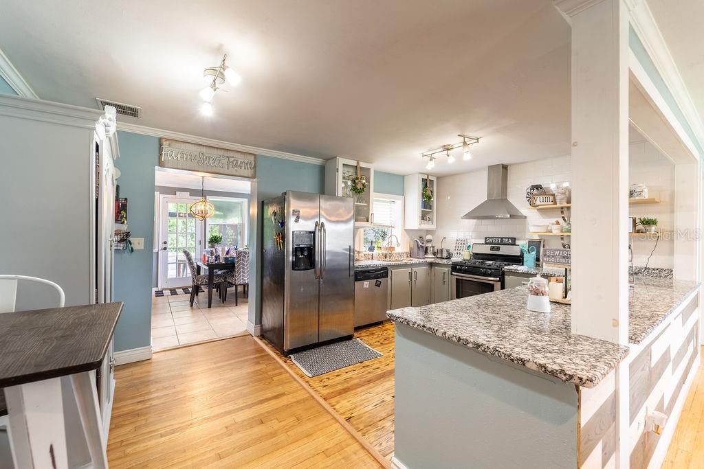 Dining room, Interior, Kitchen, Pendant Lights, Stainless Steel Appliances, Wood Texture Flooring