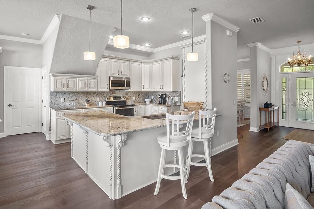 Chandelier, Interior, Kitchen, Pendant Lights, Recessed Lighting, Stainless Steel Appliances, Wood Texture Flooring