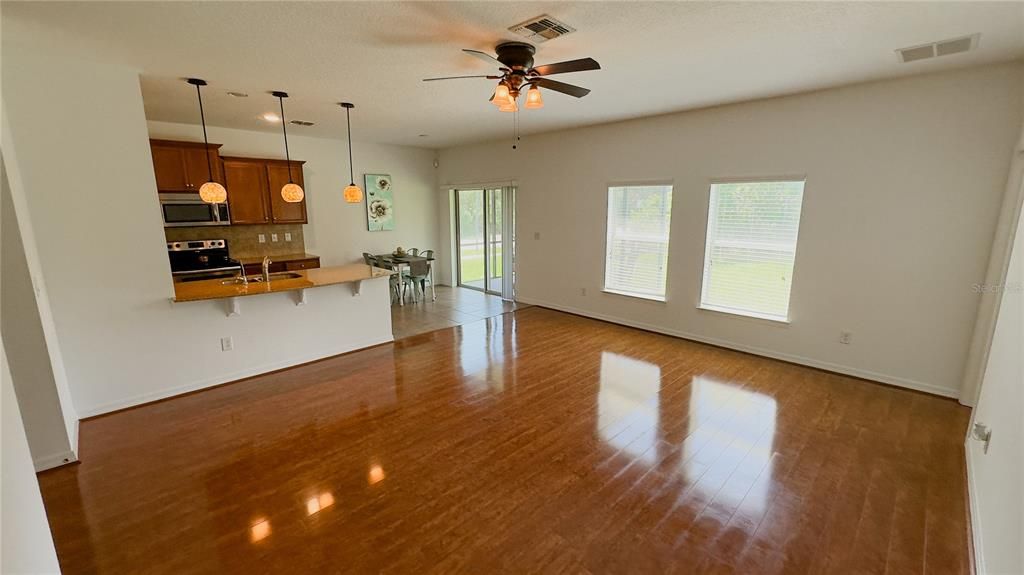 Dining room, Interior, Kitchen, Pendant Lights, Stainless Steel Appliances, Wood Texture Flooring