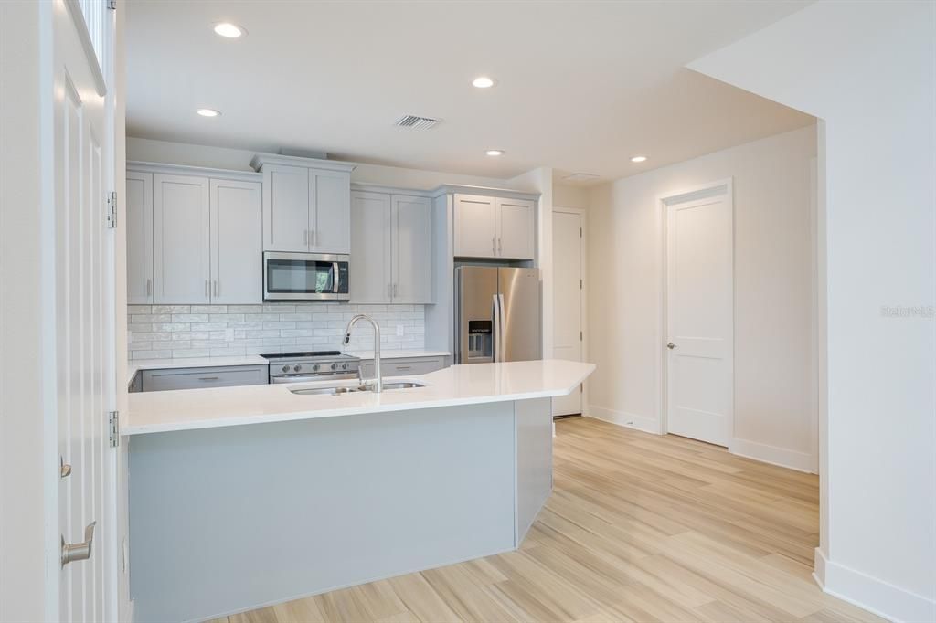 Interior, Kitchen, Recessed Lighting, Stainless Steel Appliances, Wood Texture Flooring