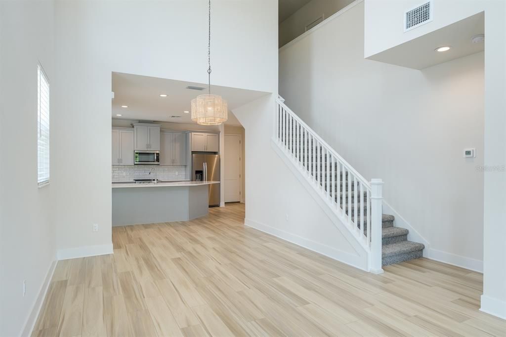 Chandelier, Interior, Kitchen, Pendant Lights, Recessed Lighting, Stainless Steel Appliances, Wood Texture Flooring