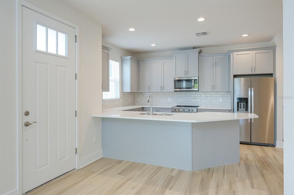 Interior, Kitchen, Recessed Lighting, Stainless Steel Appliances, Wood Texture Flooring