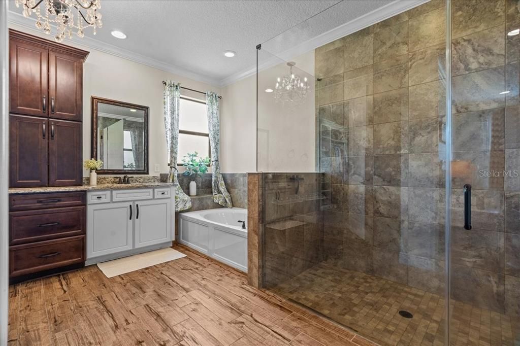 Bathroom, Chandelier, Glass Shower, Interior, Recessed Lighting, Wood Texture Flooring