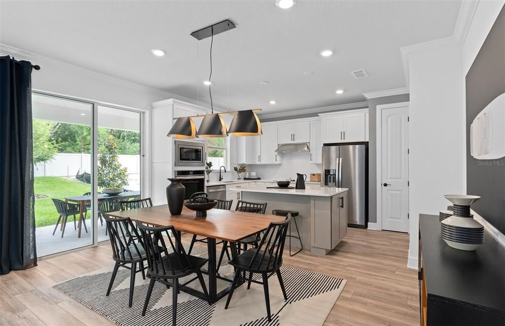 Dining room, Interior, Kitchen, Pendant Lights, Recessed Lighting, Stainless Steel Appliances, Wood Texture Flooring