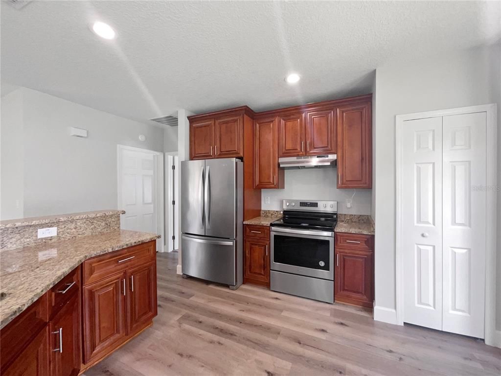 Interior, Kitchen, Recessed Lighting, Stainless Steel Appliances, Wood Texture Flooring