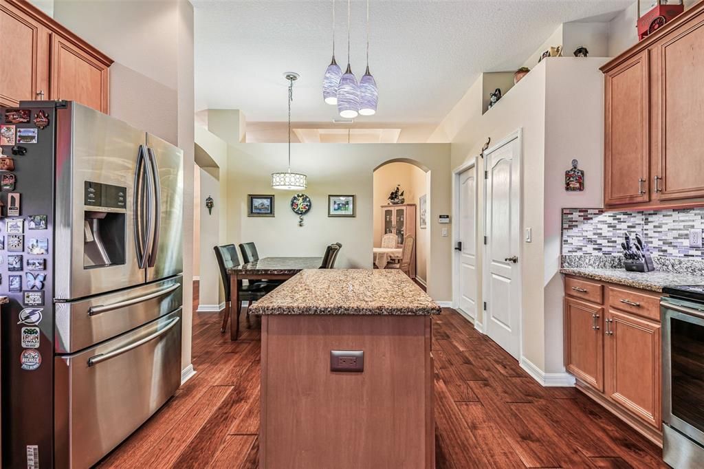 Dining room, Interior, Kitchen, Pendant Lights, Stainless Steel Appliances, Wood Texture Flooring