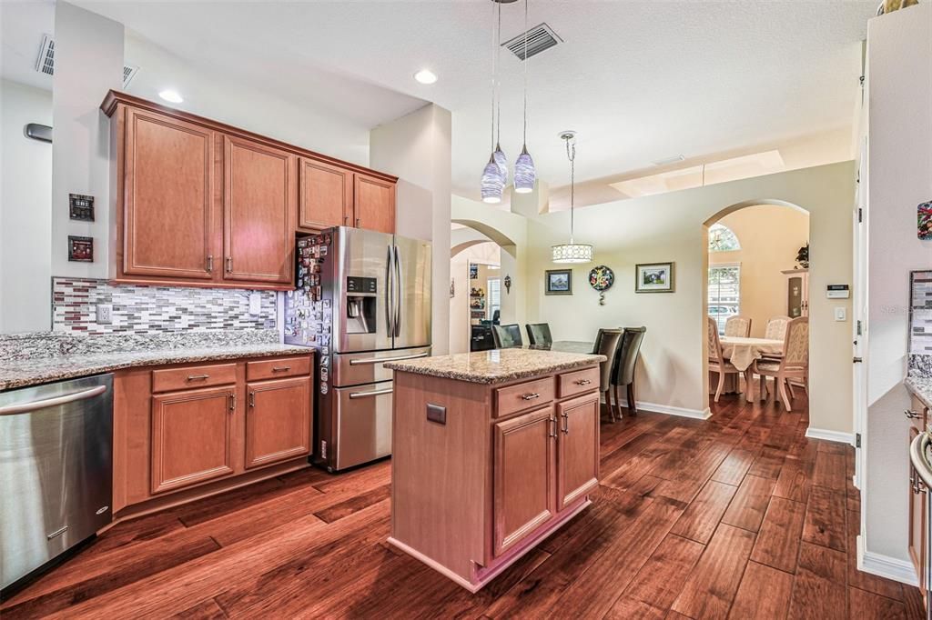 Dining room, Interior, Kitchen, Pendant Lights, Recessed Lighting, Stainless Steel Appliances, Wood Texture Flooring