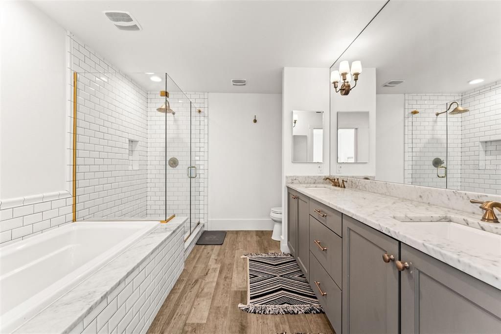 Bathroom, Dual Sink Vanities, Glass Shower, Interior, Recessed Lighting, Wood Texture Flooring