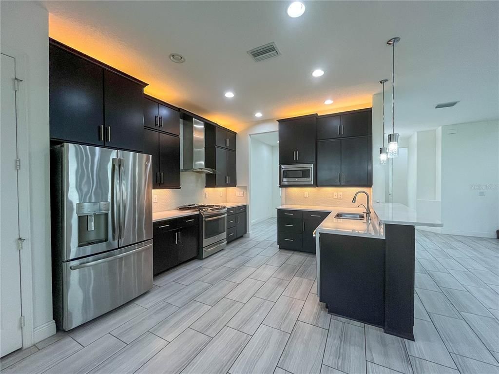 Interior, Kitchen, Pendant Lights, Recessed Lighting, Stainless Steel Appliances, Wood Texture Flooring