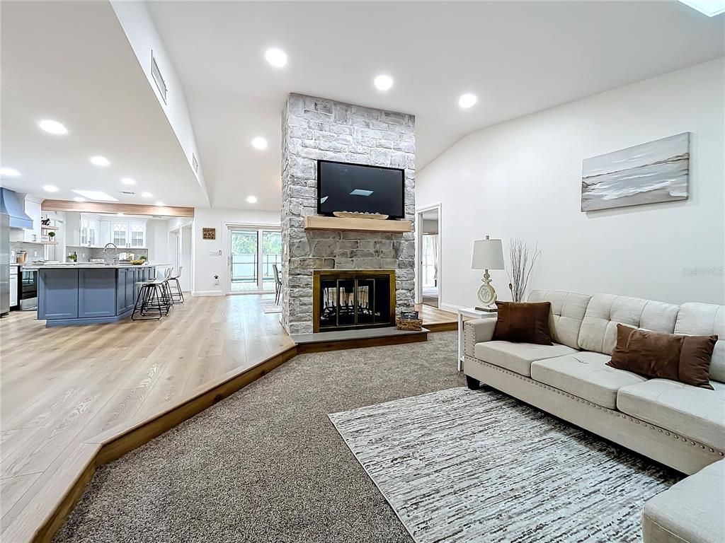 Fireplace, Interior, Kitchen, Living room, Recessed Lighting, Stone Walls, Wood Texture Flooring