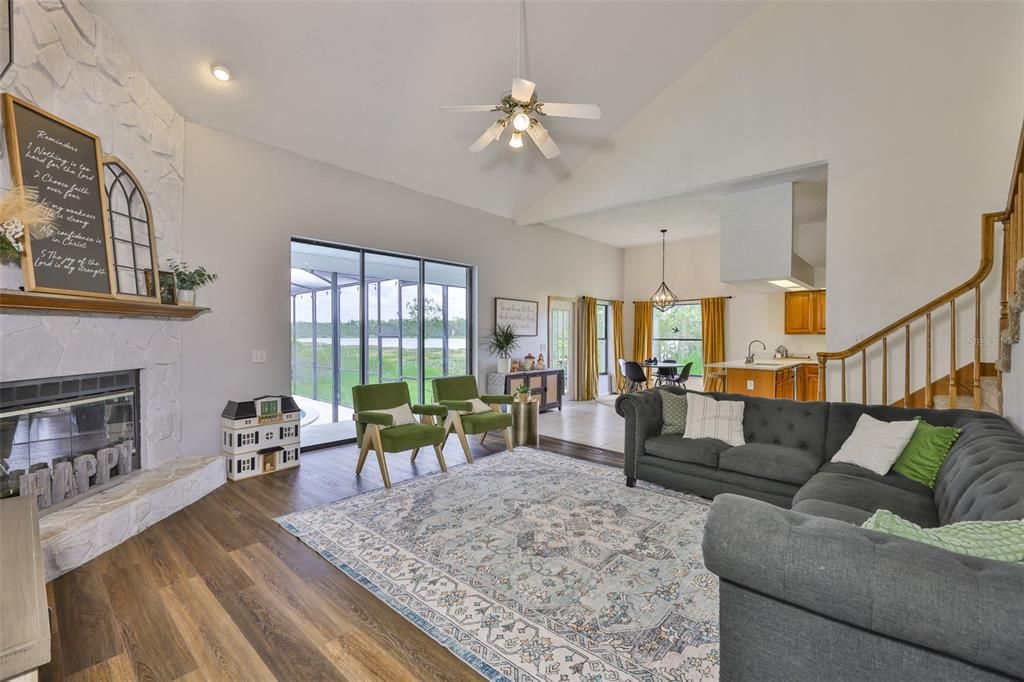 Dining room, Fireplace, Interior, Living room, Pendant Lights, Recessed Lighting, Wood Texture Flooring