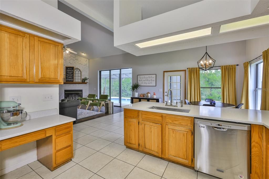 Dining room, Fireplace, Interior, Kitchen, Living room, Pendant Lights, Stainless Steel Appliances
