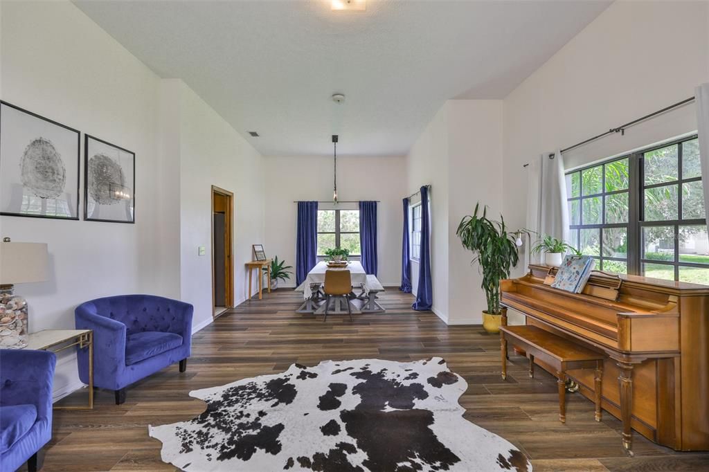 Dining room, Interior, Pendant Lights, Piano, Wood Texture Flooring