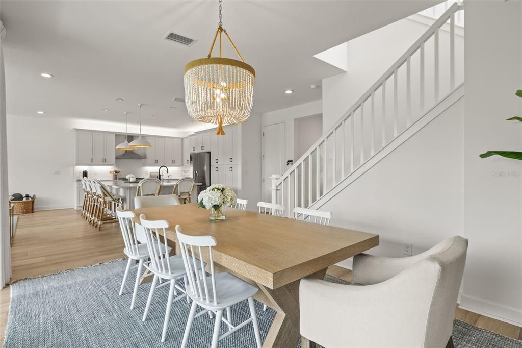 Chandelier, Dining room, Interior, Kitchen, Pendant Lights, Recessed Lighting, Stainless Steel Appliances, Wood Texture Flooring