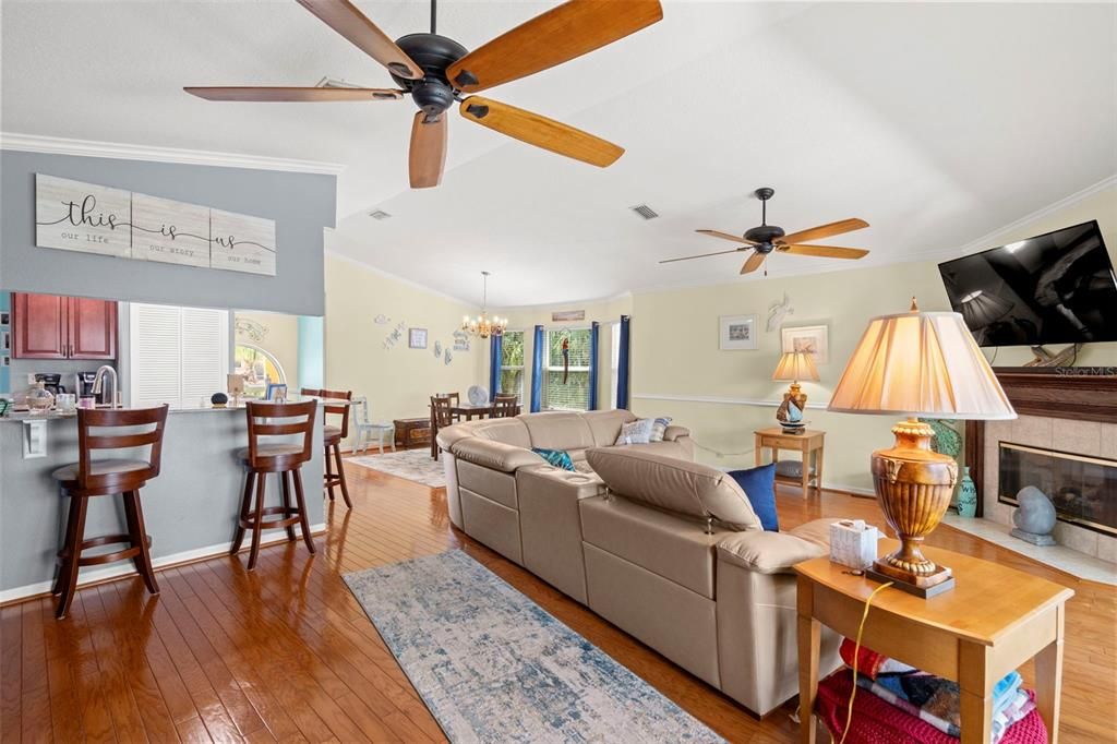 Chandelier, Dining room, Fireplace, Interior, Kitchen, Living room, Pendant Lights, Wood Texture Flooring