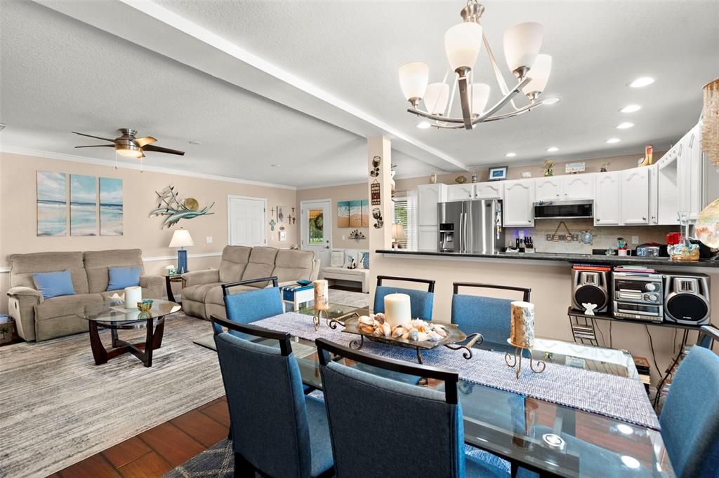 Chandelier, Dining room, Interior, Kitchen, Living room, Recessed Lighting, Stainless Steel Appliances, Wood Texture Flooring