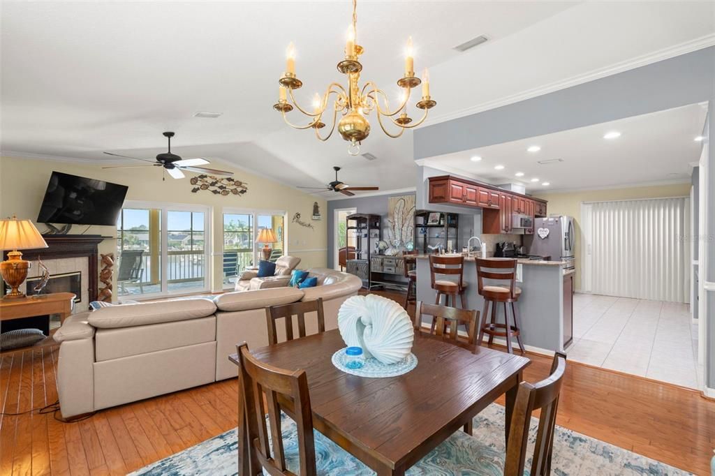 Chandelier, Dining room, Fireplace, Interior, Kitchen, Living room, Recessed Lighting, Wood Texture Flooring