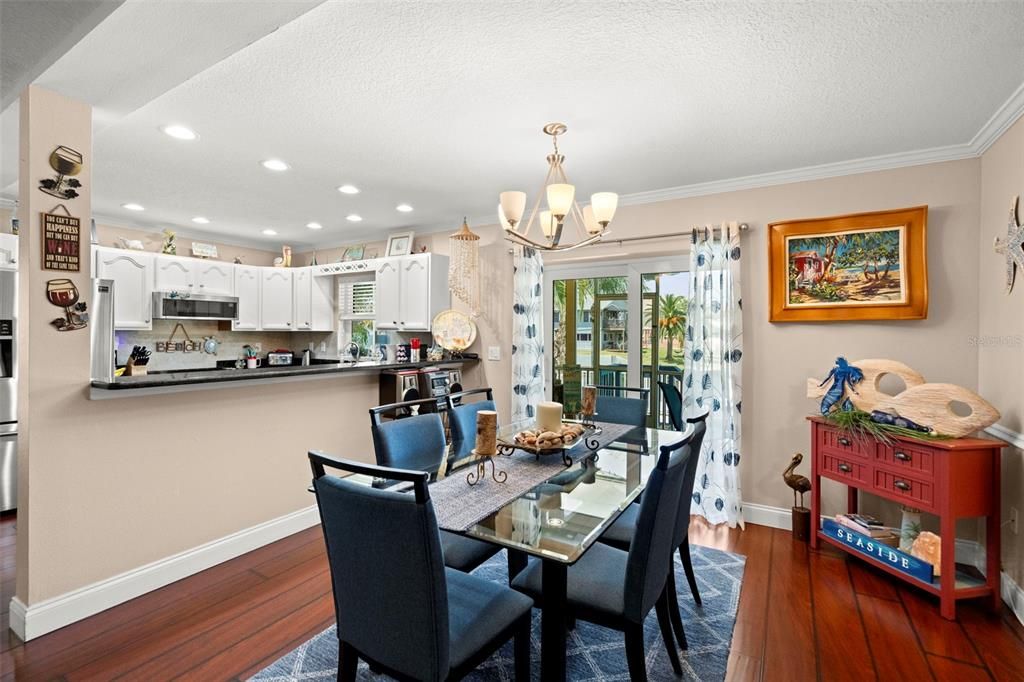 Chandelier, Dining room, Interior, Kitchen, Recessed Lighting, Stainless Steel Appliances, Wood Texture Flooring