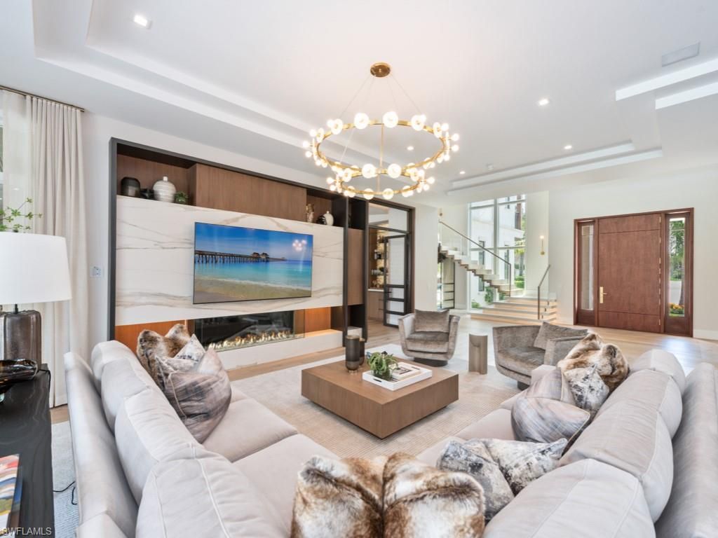 Fireplace, Interior, Living room, Marble Walls, Pendant Lights, Recessed Lighting, Wood Texture Flooring