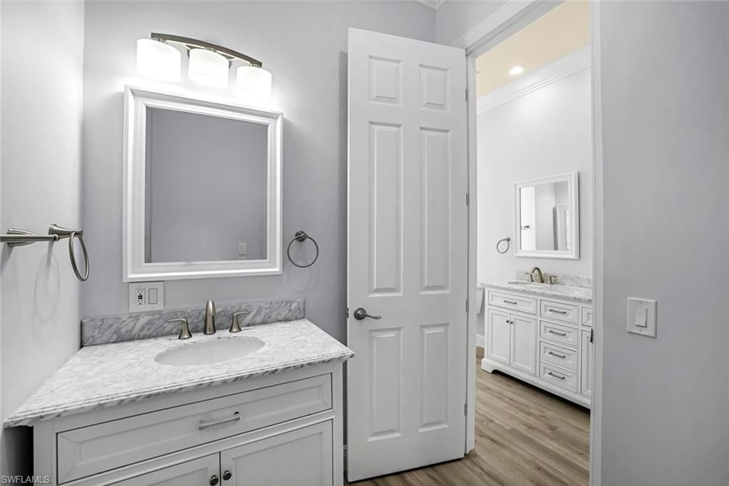 Bathroom, Dual Sink Vanities, Interior, Recessed Lighting, Wood Texture Flooring