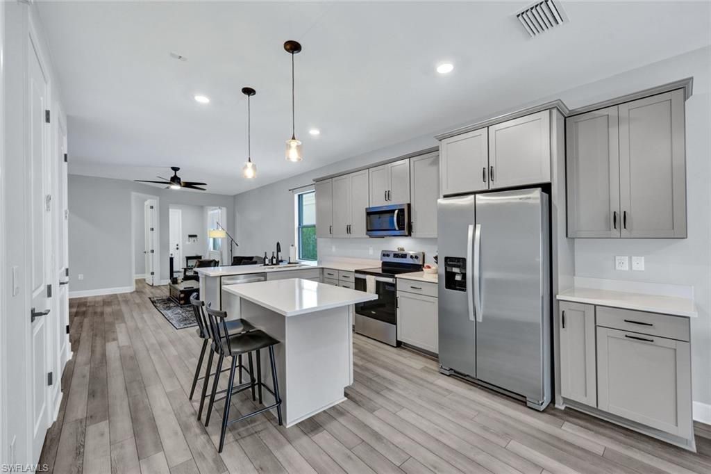Interior, Kitchen, Pendant Lights, Recessed Lighting, Stainless Steel Appliances, Wood Texture Flooring