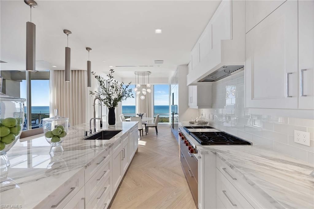 Dining room, Interior, Kitchen, Pendant Lights, Recessed Lighting, Stainless Steel Appliances, Water, Wood Texture Flooring