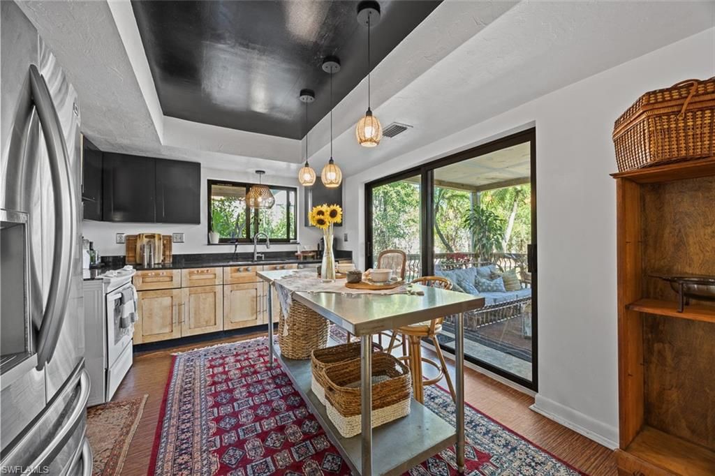Dining room, Interior, Kitchen, Pendant Lights, Stainless Steel Appliances, Wood Texture Flooring