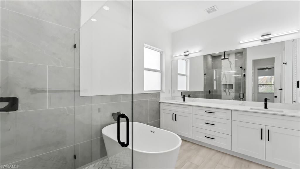 Bathroom, Dual Sink Vanities, Free Standing Baths, Glass Shower, Interior, Wood Texture Flooring