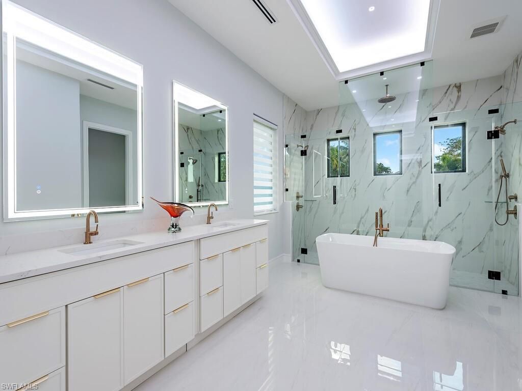 Bathroom, Dual Sink Vanities, Free Standing Baths, Glass Shower, Interior, Marble, Marble Walls, Recessed Lighting