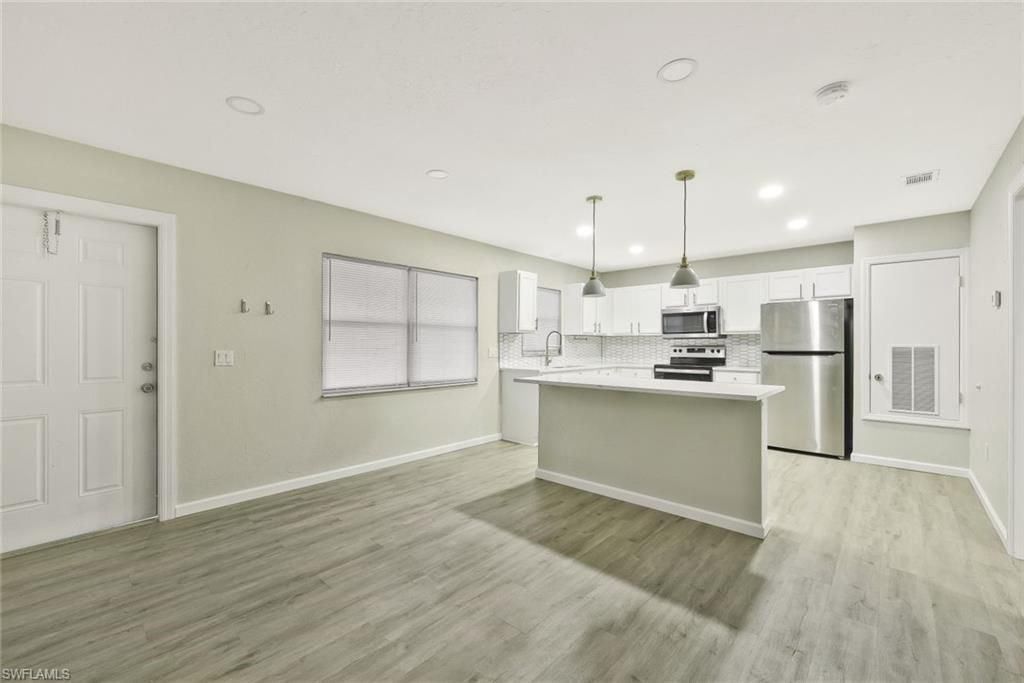 Interior, Kitchen, Pendant Lights, Recessed Lighting, Stainless Steel Appliances, Wood Texture Flooring