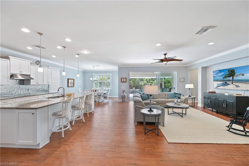 Dining room, Interior, Kitchen, Living room, Pendant Lights, Recessed Lighting, Stainless Steel Appliances, Wood Texture Flooring
