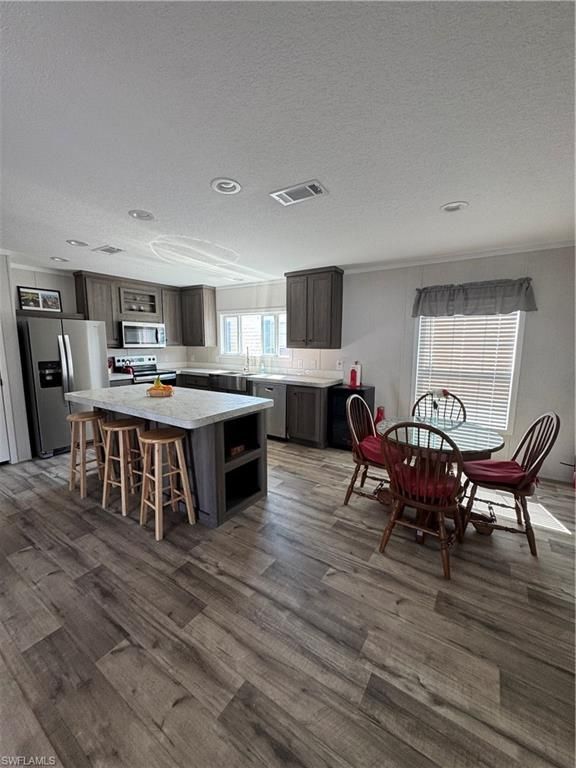 Dining room, Interior, Kitchen, Recessed Lighting, Stainless Steel Appliances, Wood Texture Flooring