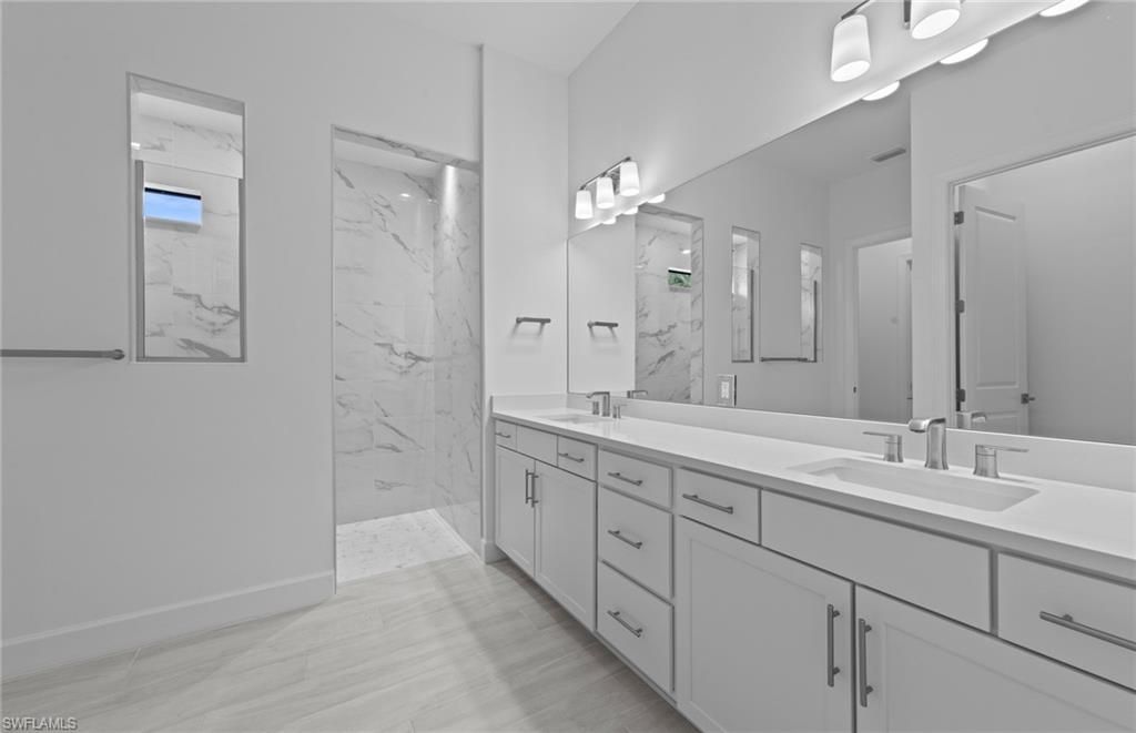 Bathroom, Dual Sink Vanities, Glass Shower, Interior, Marble, Marble Walls, Wood Texture Flooring