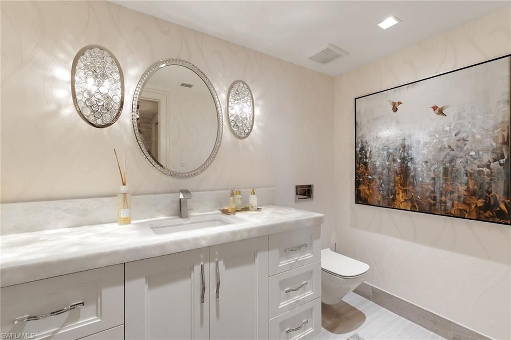 Bathroom, Dual Sink Vanities, Interior, Marble Walls, Recessed Lighting, Wood Texture Flooring