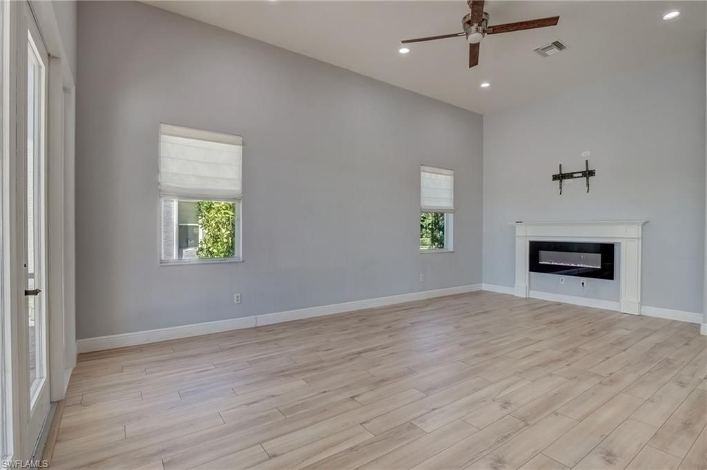 Empty room, Fireplace, Interior, Recessed Lighting, Wood Texture Flooring