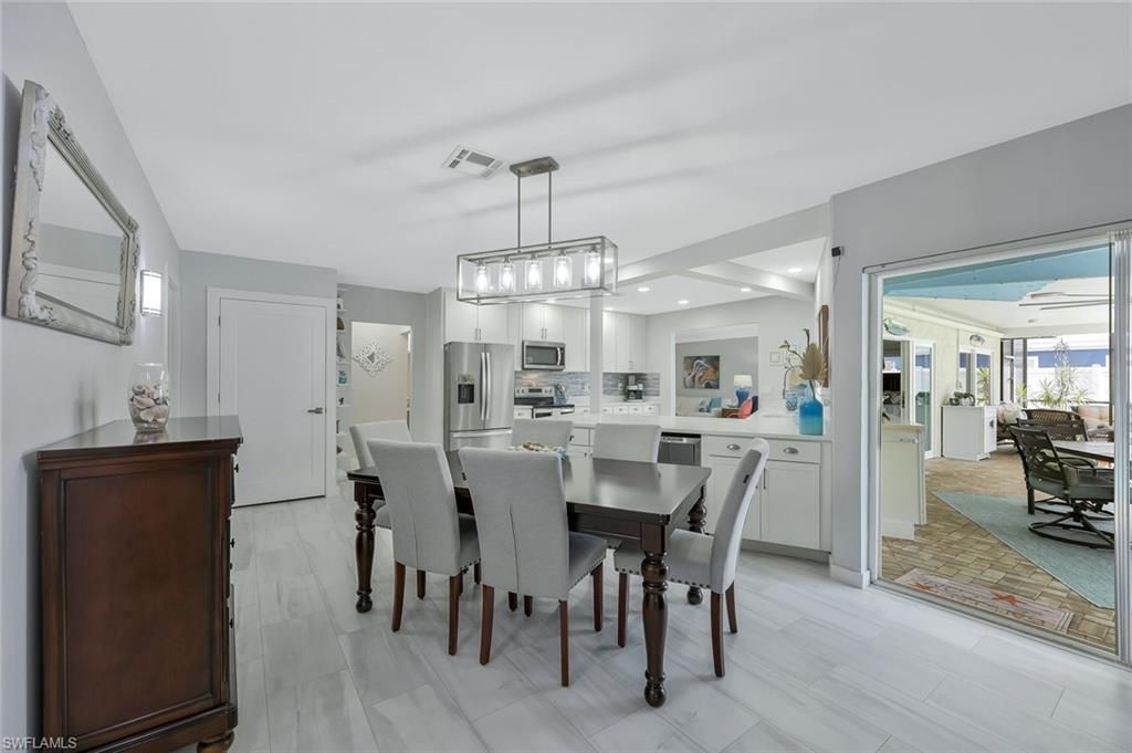 Dining room, Interior, Kitchen, Pendant Lights, Recessed Lighting, Stainless Steel Appliances, Wood Texture Flooring