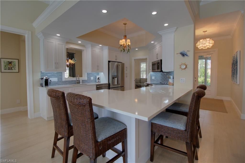 Chandelier, Dining room, Interior, Kitchen, Recessed Lighting, Stainless Steel Appliances, Wood Texture Flooring