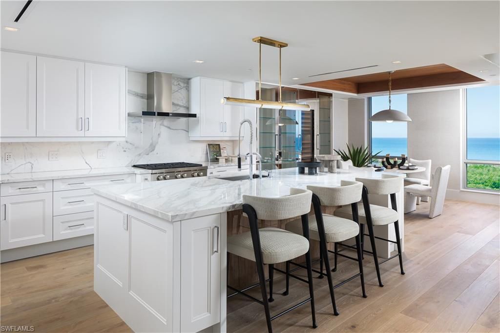 Dining room, Interior, Kitchen, Marble Walls, Pendant Lights, Recessed Lighting, Stainless Steel Appliances, Water, Wood Texture Flooring
