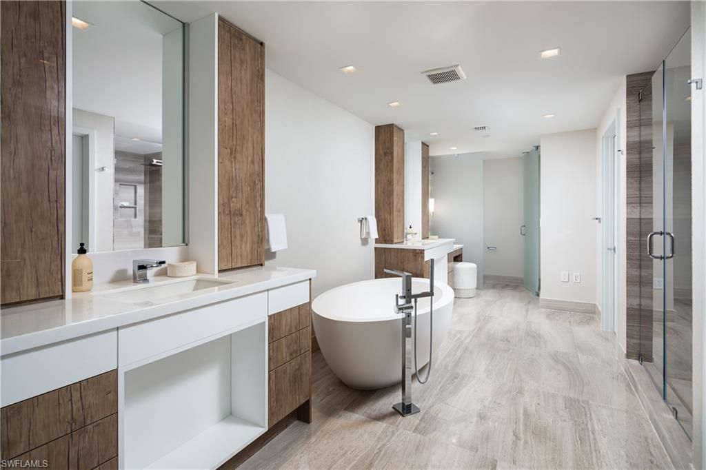 Bathroom, Dual Sink Vanities, Free Standing Baths, Glass Shower, Interior, Recessed Lighting, Wood Texture Flooring