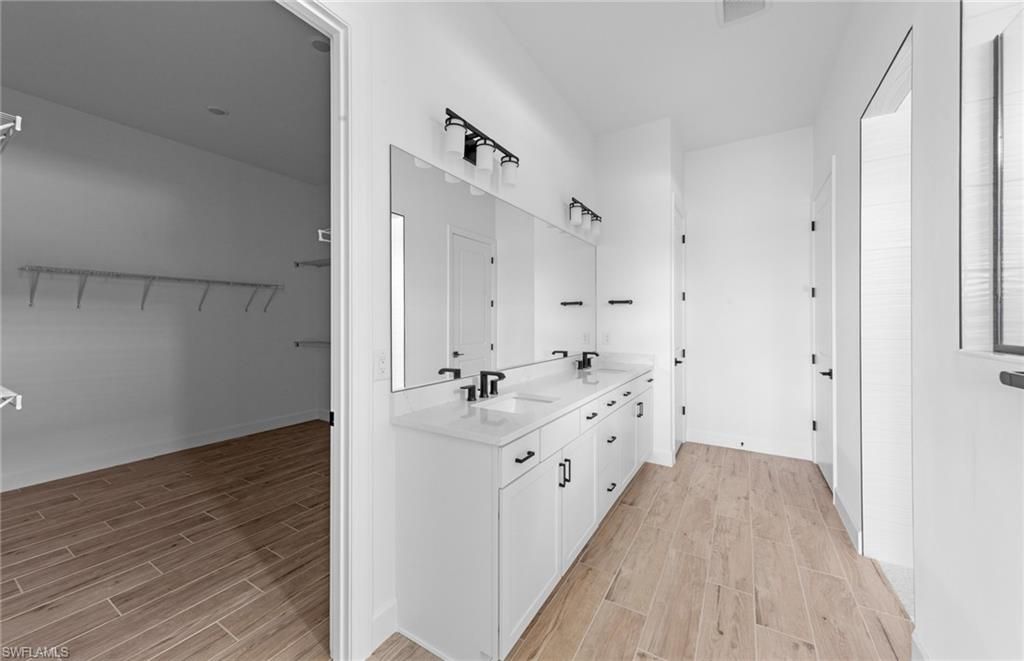 Bathroom, Dual Sink Vanities, Interior, Walk-in Closets, Wood Texture Flooring