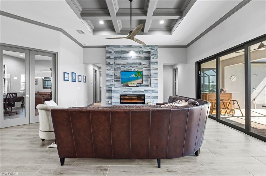 Fireplace, Interior, Living room, Recessed Lighting, Stone Walls, Wood Texture Flooring