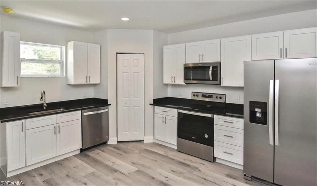Interior, Kitchen, Recessed Lighting, Stainless Steel Appliances, Wood Texture Flooring