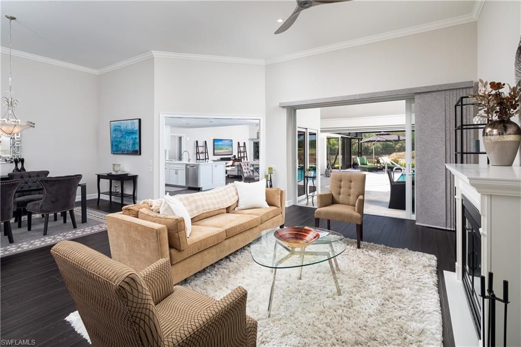 Dining room, Fireplace, Interior, Living room, Pendant Lights, Recessed Lighting, Wood Texture Flooring