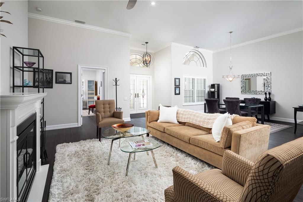 Chandelier, Dining room, Fireplace, Interior, Living room, Pendant Lights, Recessed Lighting, Wood Texture Flooring